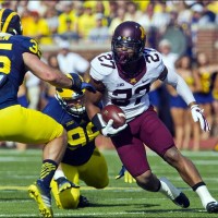 Minnesota running back David Cobb (27) rushes in the first quarter of an NCAA college football game against Michigan. ASSOCIATED PRESS